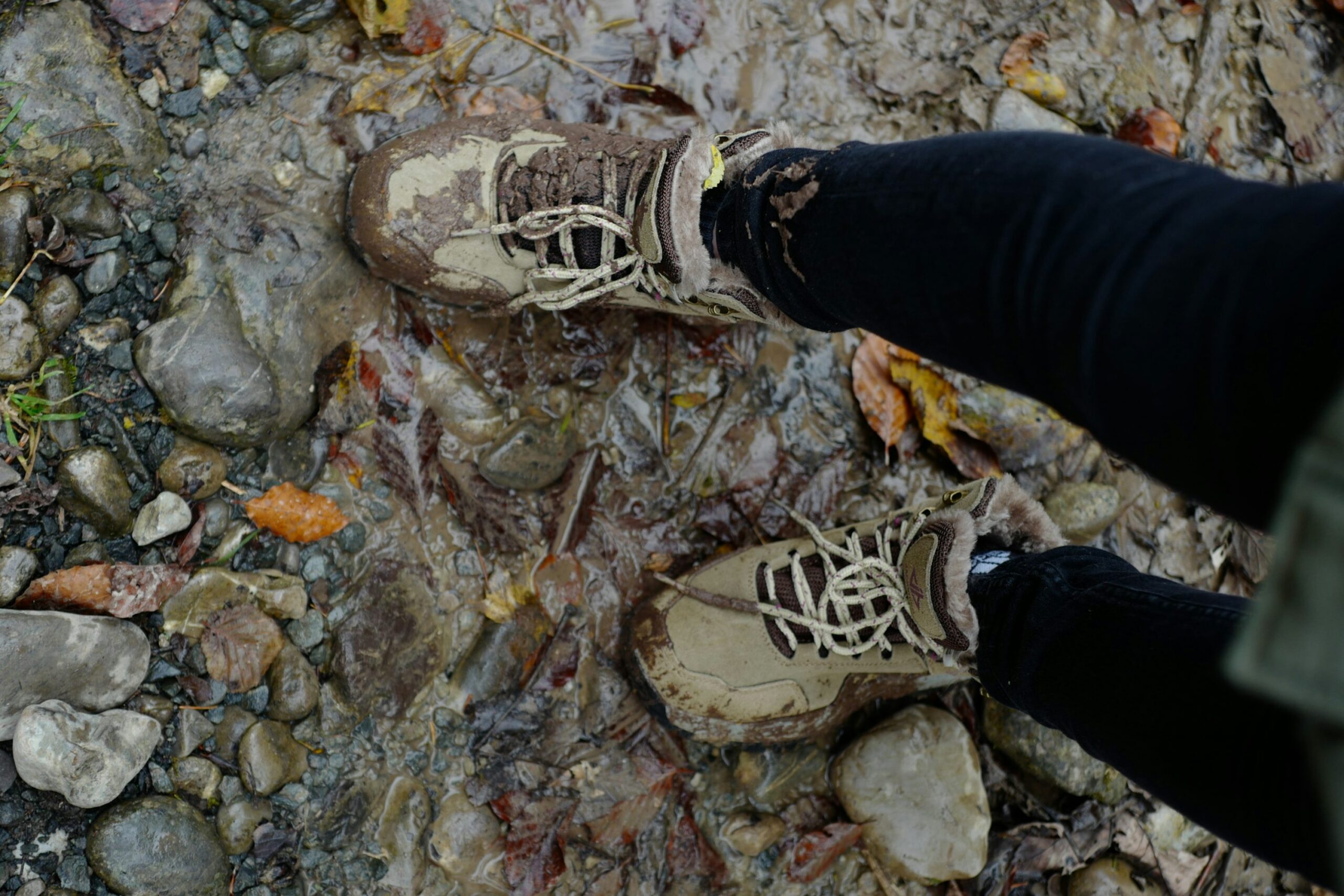 a person standing on top of a rocky ground